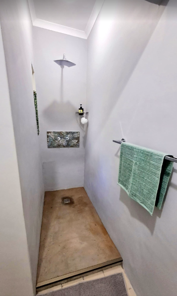 Walk-in shower with rainfall showerhead